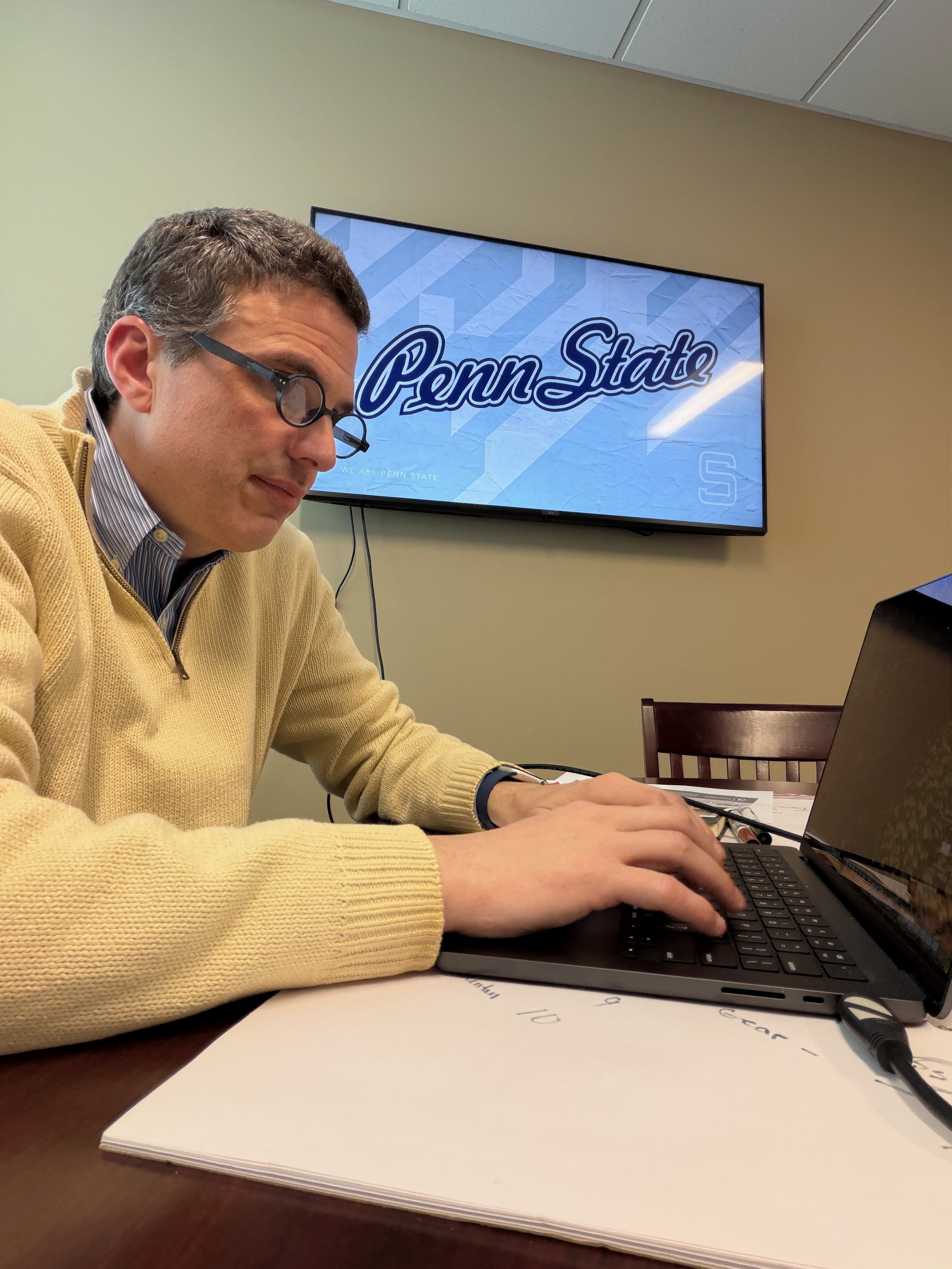 Penn State communications expert Ryan Abramson in Center Valley, PA writing a news story for Penn State news.